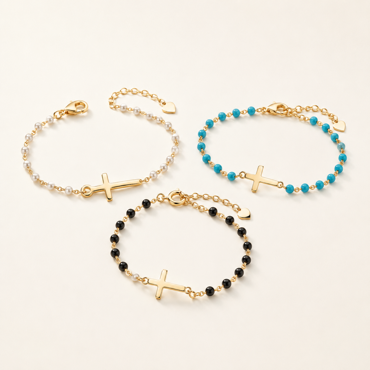 Tres pulsera en oro amarillo de 14 quilates, con eslabones y perlas de piedras preciosas